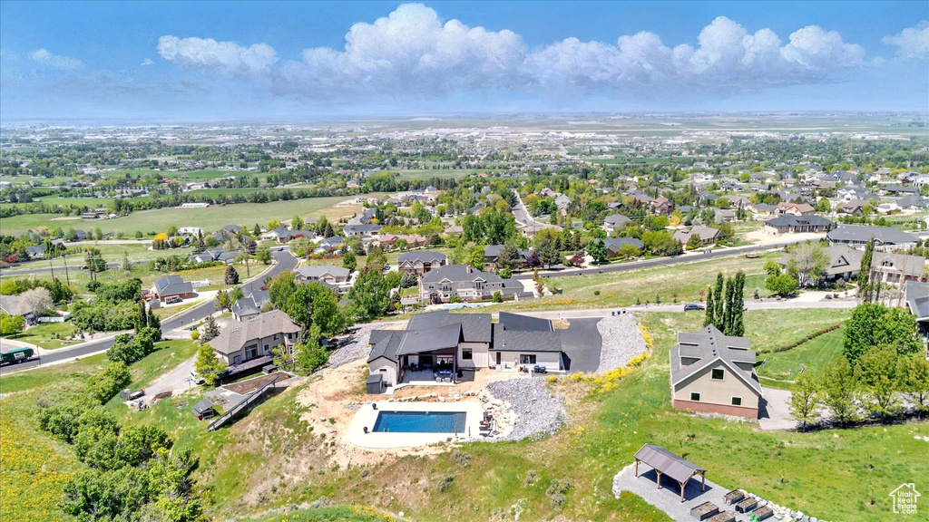 Aerial view of residential area featuring a pool