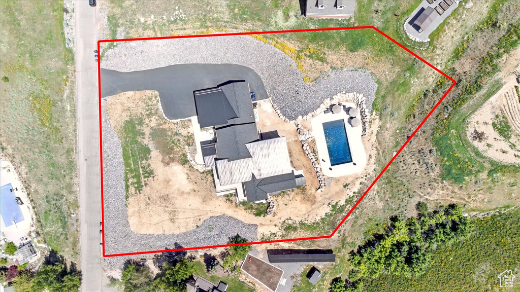 Aerial view of property and surrounding area featuring property boundaries highlighted