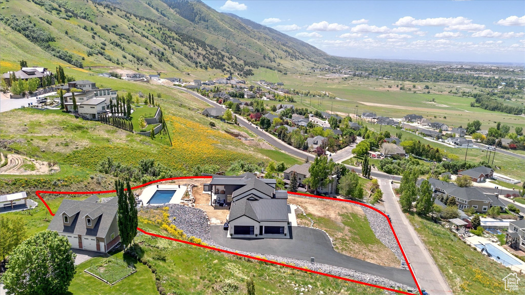 Aerial perspective of suburban area featuring property boundaries highlighted