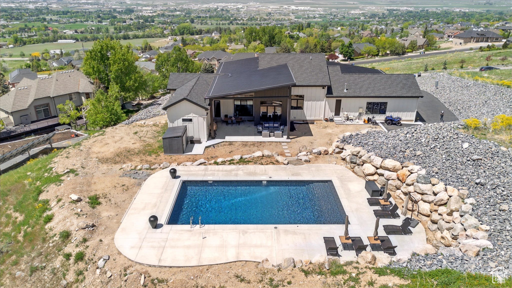 Outdoor pool featuring a patio area