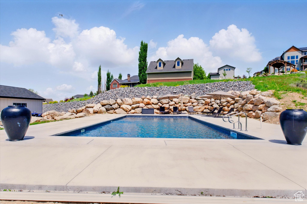Swimming pool with a patio
