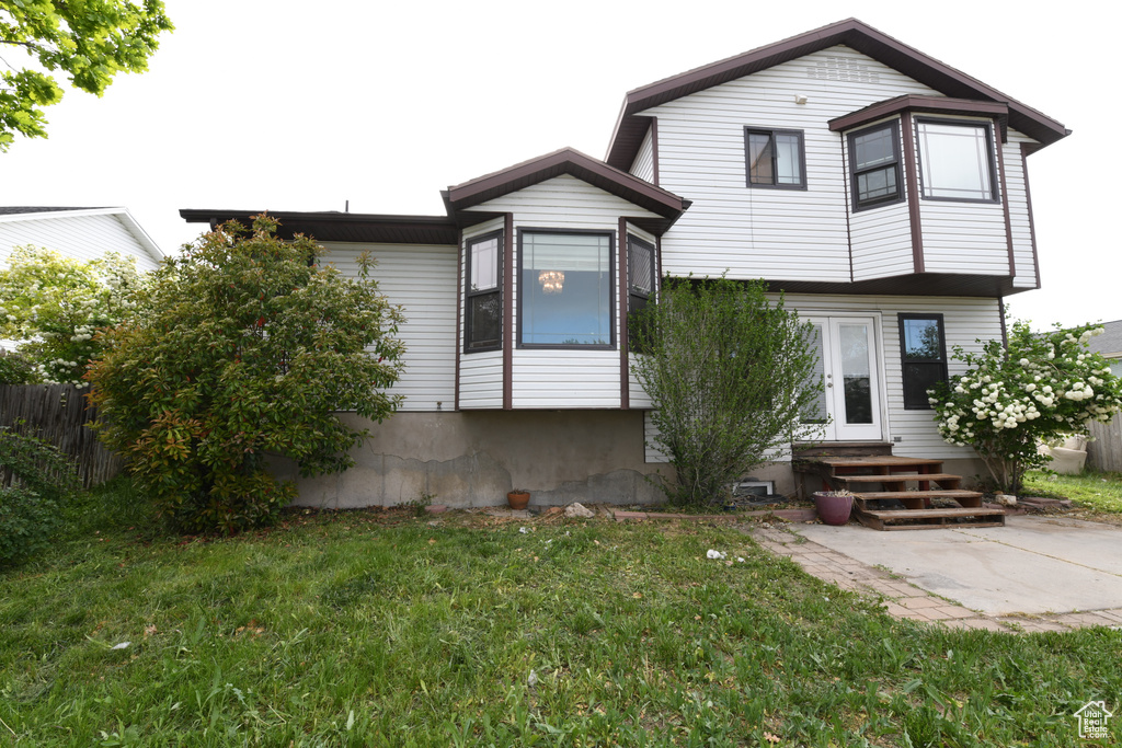 Back of property featuring entry steps