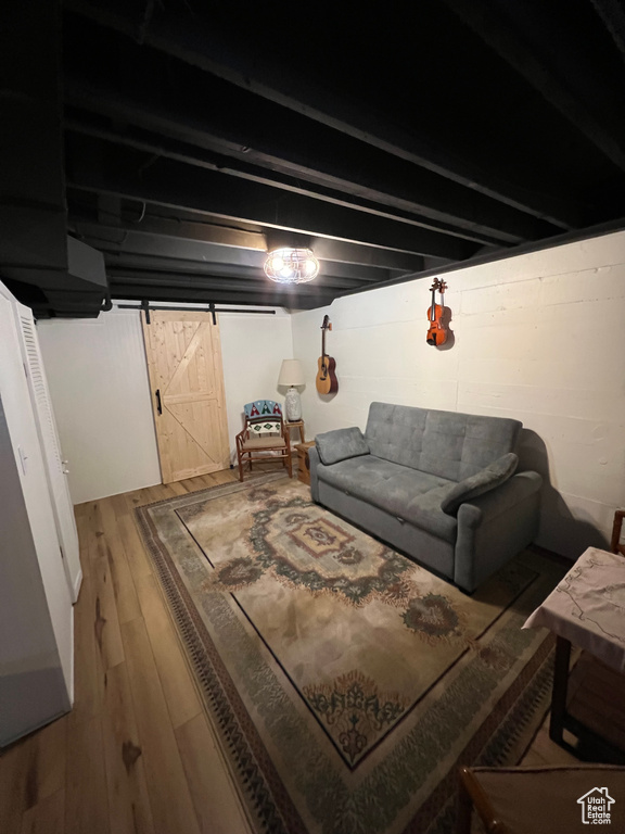 Interior space featuring a barn door and hardwood / wood-style flooring