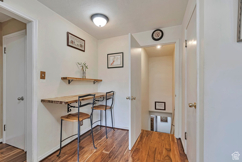 Hallway featuring wood finished floors