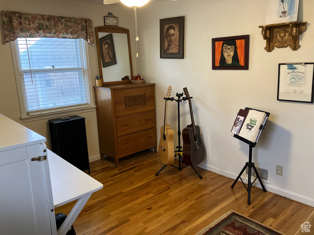 Interior space featuring baseboards and wood finished floors