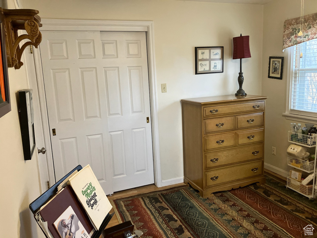 Interior space featuring a closet and baseboards
