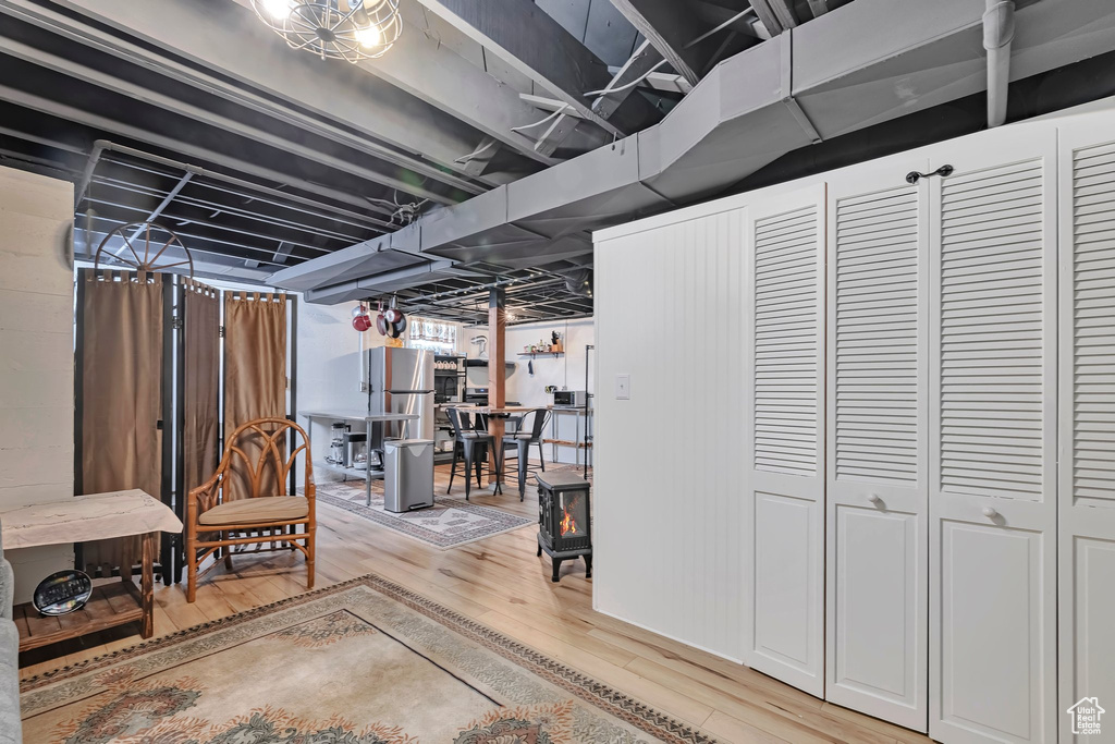 Finished below grade area with light wood-style floors