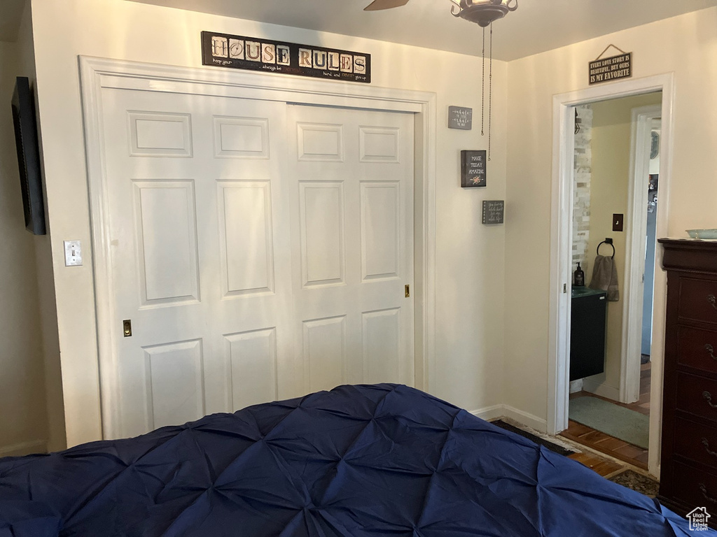Bedroom featuring a closet and baseboards