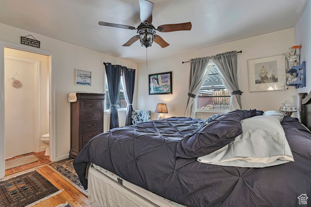 Bedroom featuring wood finished floors and a ceiling fan