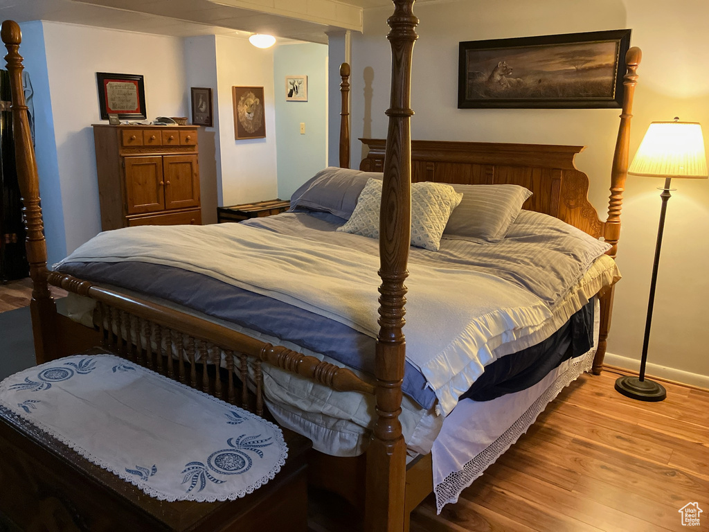 Bedroom featuring baseboards and light wood finished floors