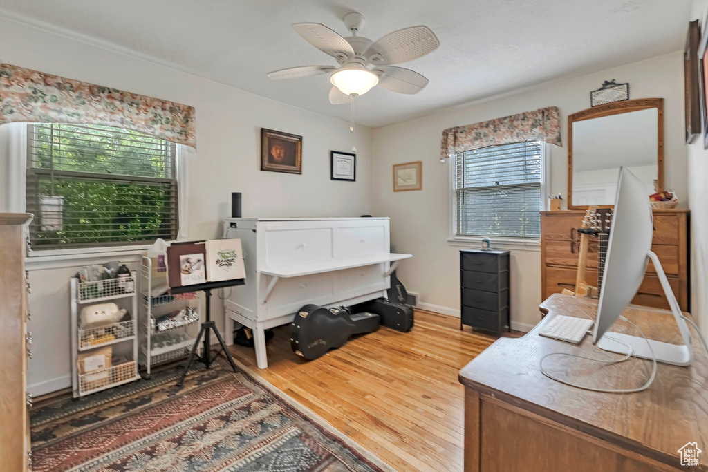Office featuring wood finished floors and ceiling fan