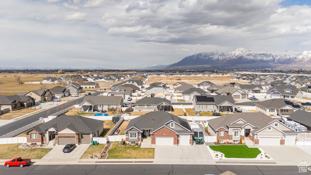 Birds eye view of property with a mountain view and a residential view