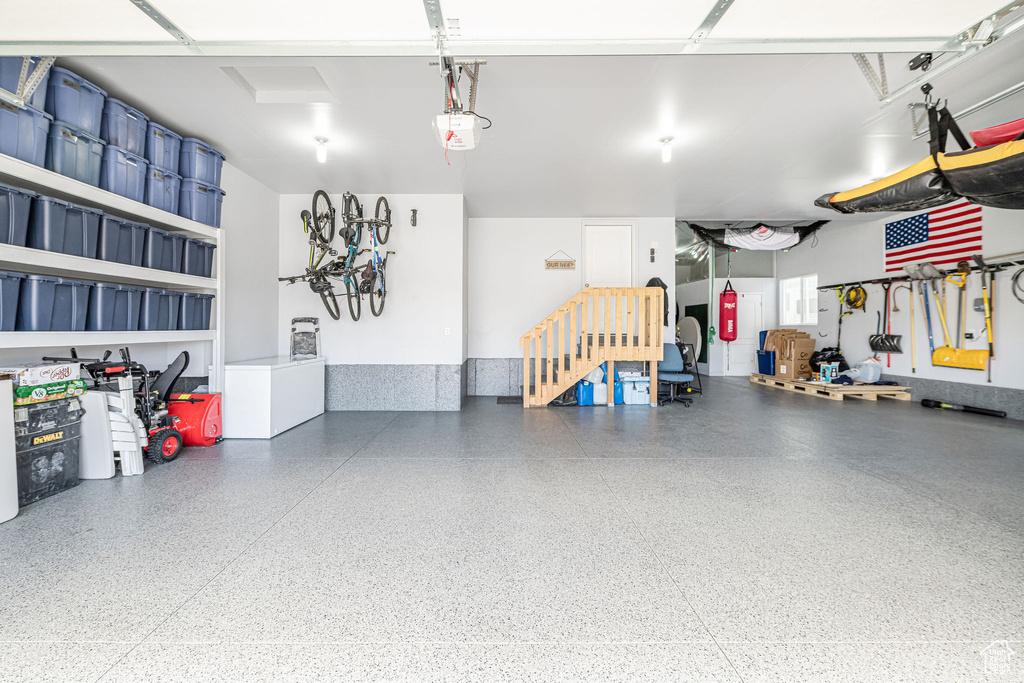 Garage featuring a garage door opener