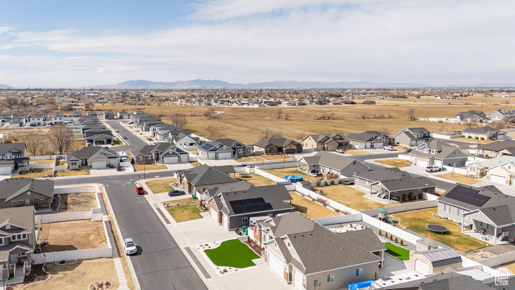 Drone / aerial view with a residential view and a mountain view