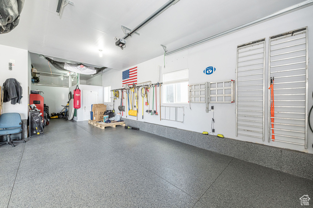 Garage featuring a garage door opener