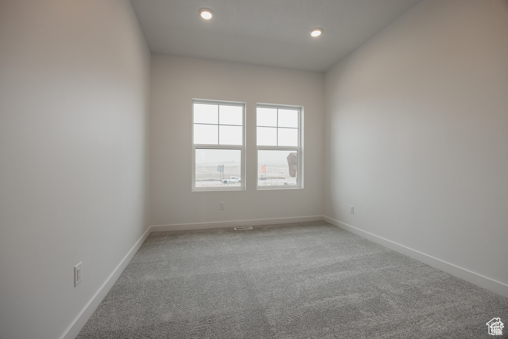 Unfurnished room featuring recessed lighting, carpet, and baseboards