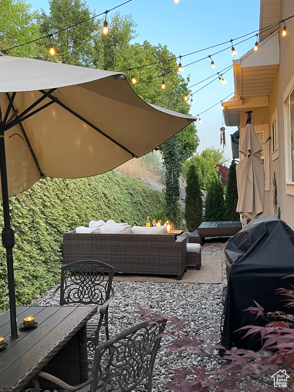 View of patio / terrace with an outdoor living space with a fire pit and outdoor dining area