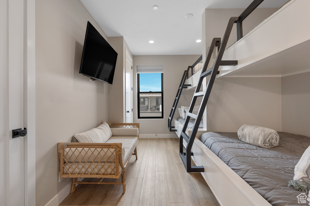 Bedroom featuring recessed lighting, light wood-style floors, and baseboards