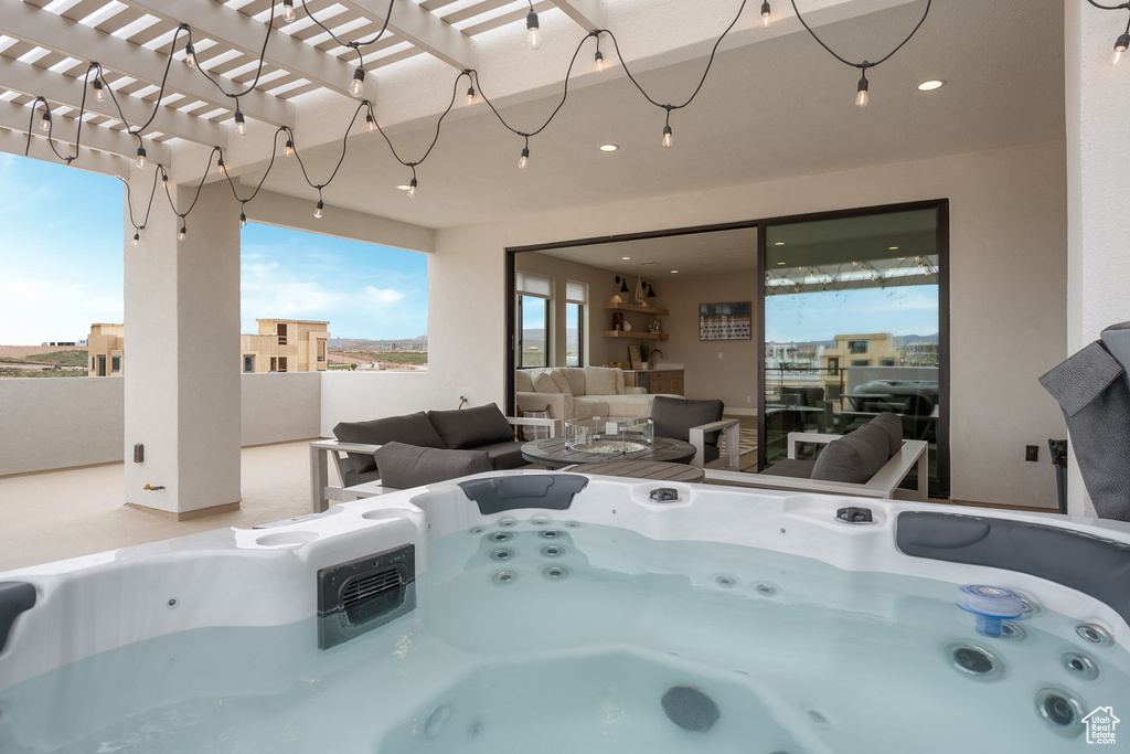 View of pool featuring a hot tub