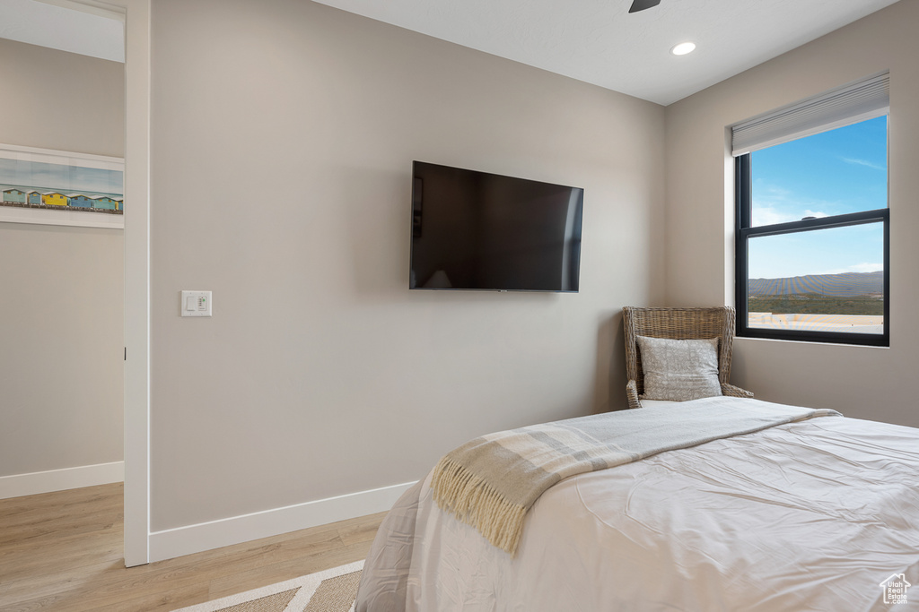 Bedroom featuring recessed lighting, light wood-type flooring, and baseboards