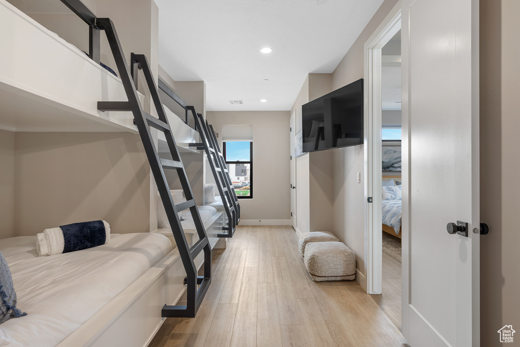 Bedroom with recessed lighting, visible vents, baseboards, and light wood-style flooring
