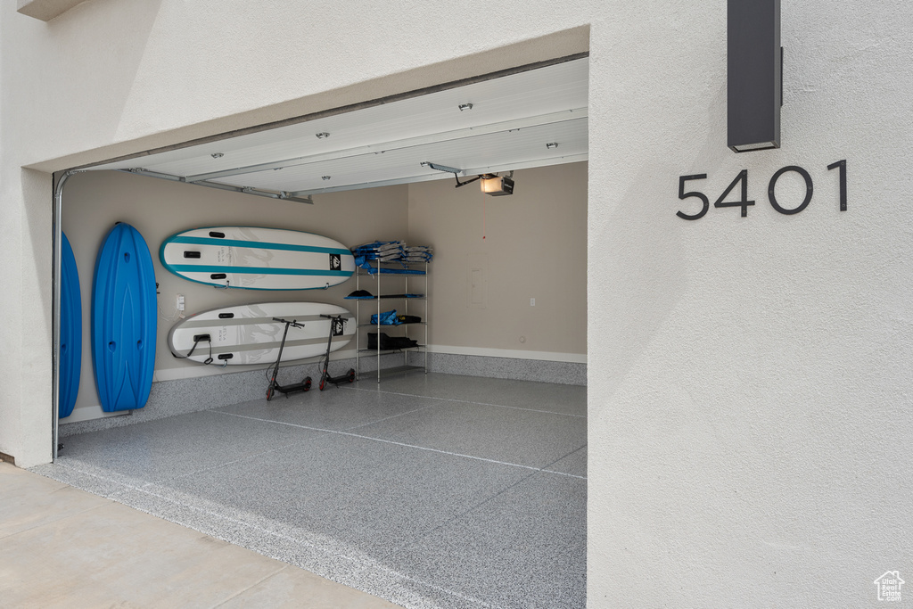 Garage featuring a garage door opener