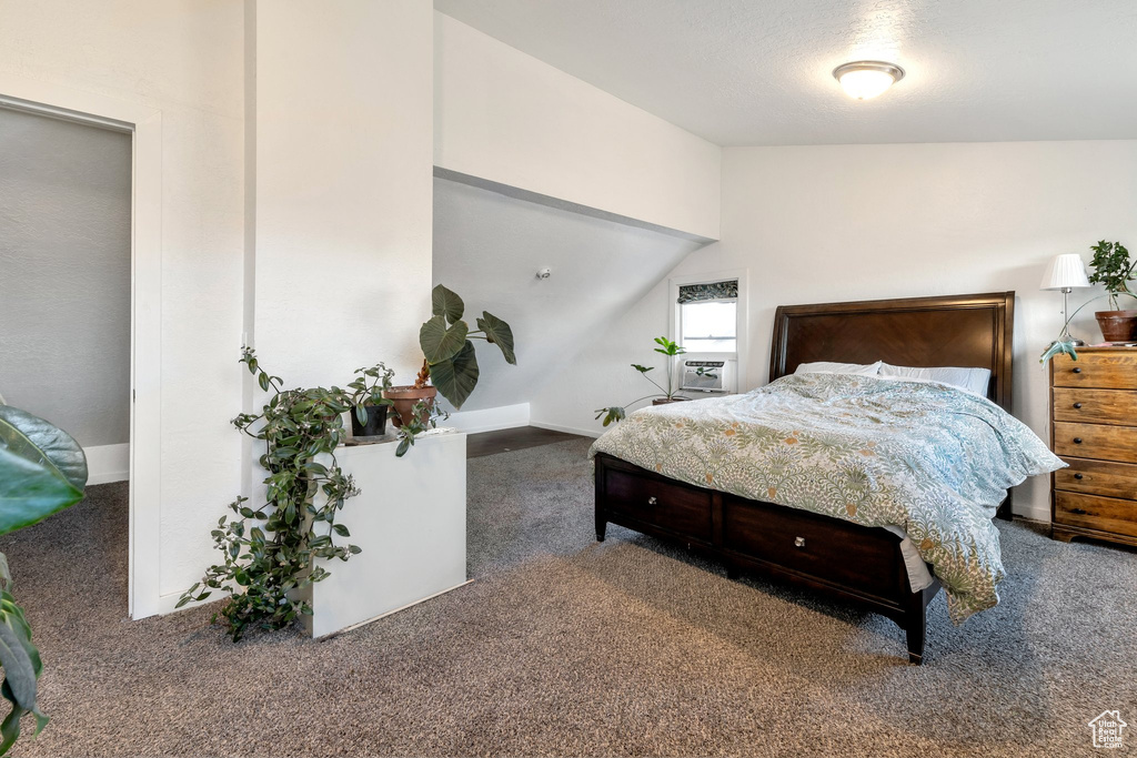 Bedroom with baseboards and carpet floors
