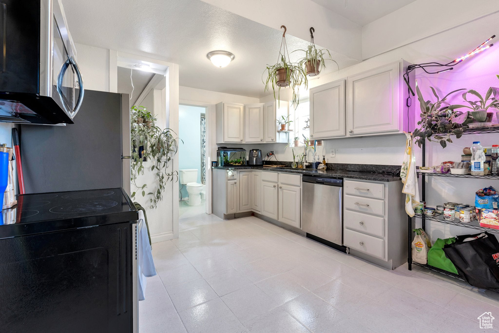 Kitchen with a sink and stainless steel appliances