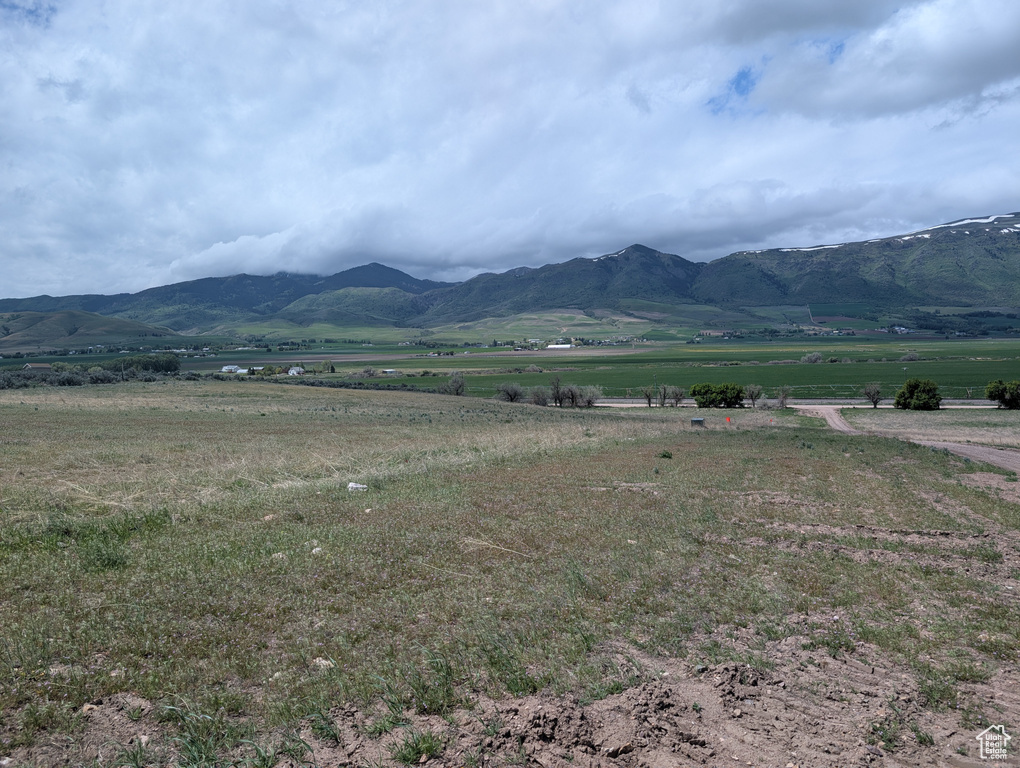 View of mountain background featuring rural landscape