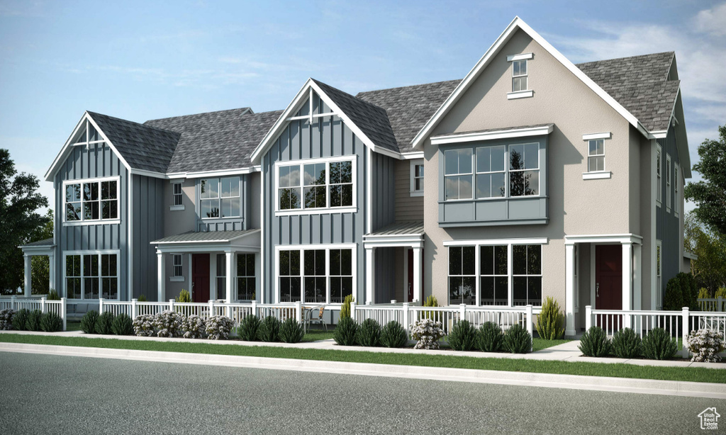 View of front of home featuring a porch, board and batten siding, and a shingled roof