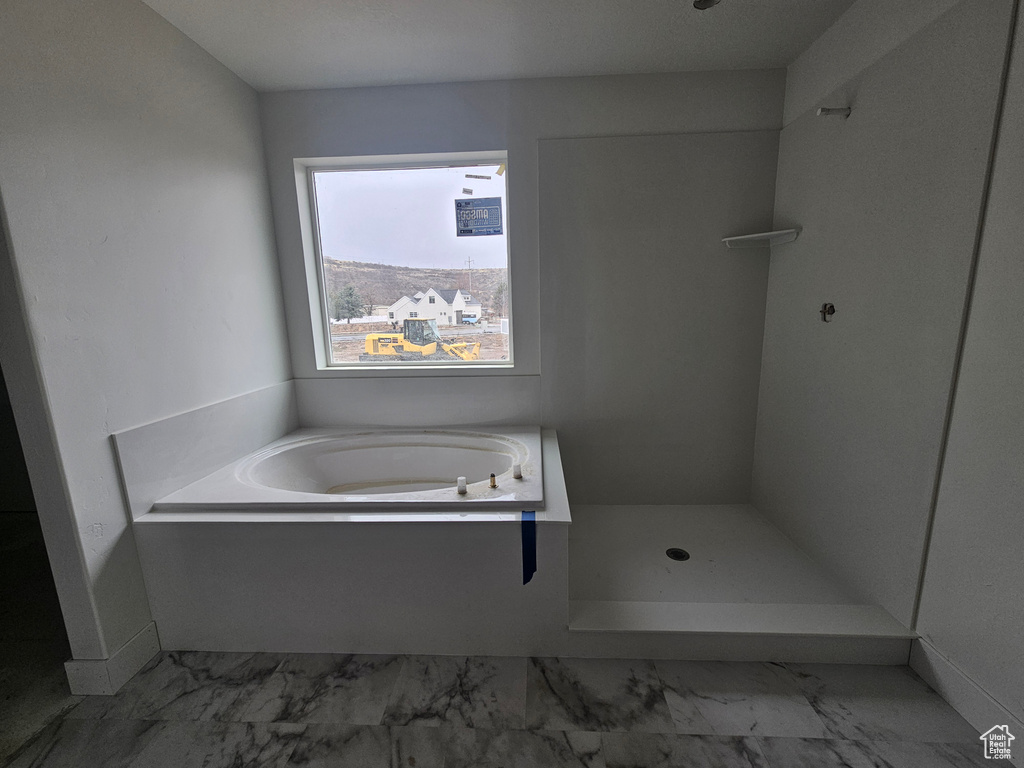 Full bath with a bath, a shower, and marble finish floor