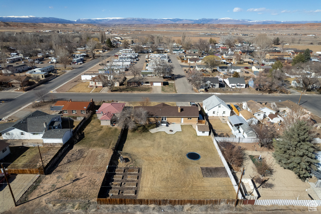 Drone / aerial view with a mountain view and a residential view
