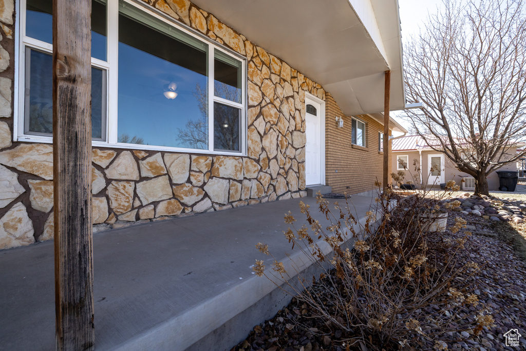 View of side of home with stone siding