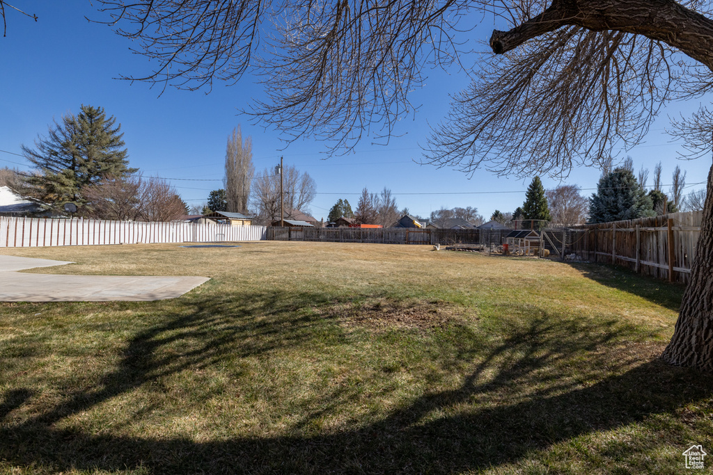 View of yard with a fenced backyard