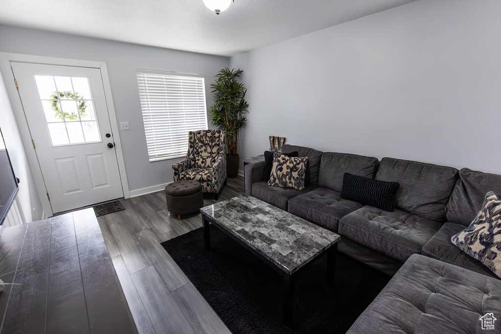 Living area featuring baseboards and wood finished floors