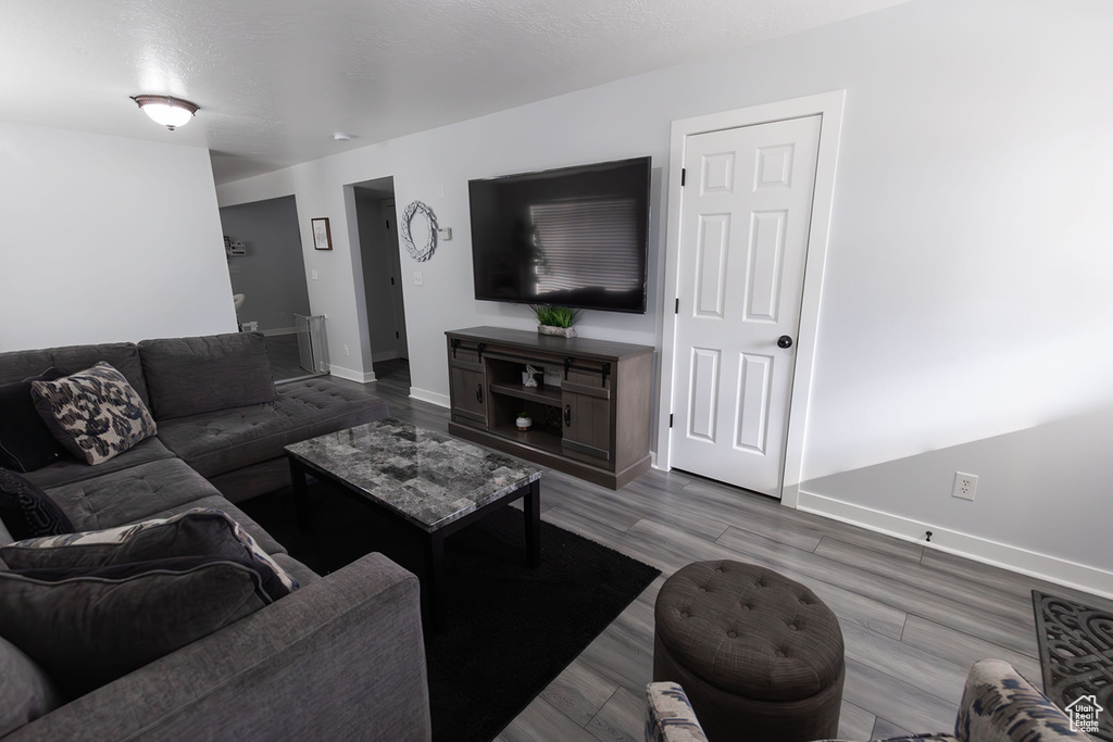 Living room featuring baseboards and wood finished floors
