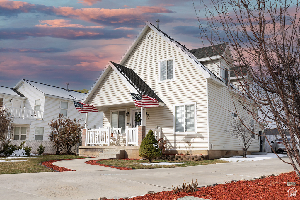 View of front of home featuring covered porch