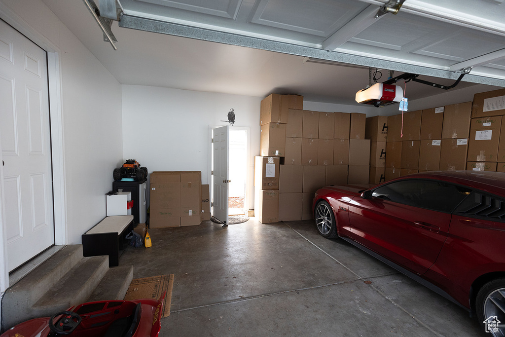 Garage featuring a garage door opener