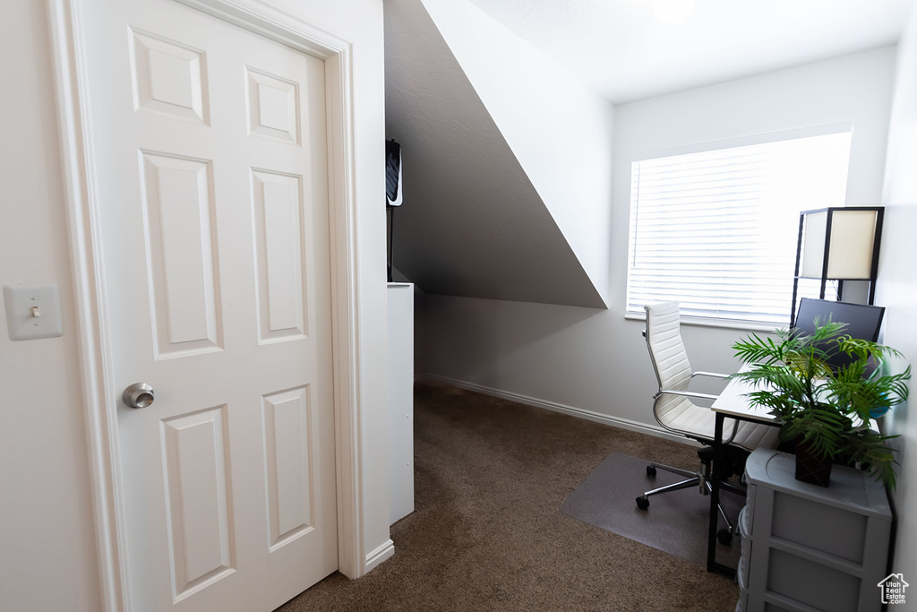 Carpeted office featuring baseboards