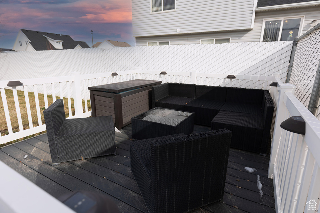 Deck at dusk with outdoor lounge area