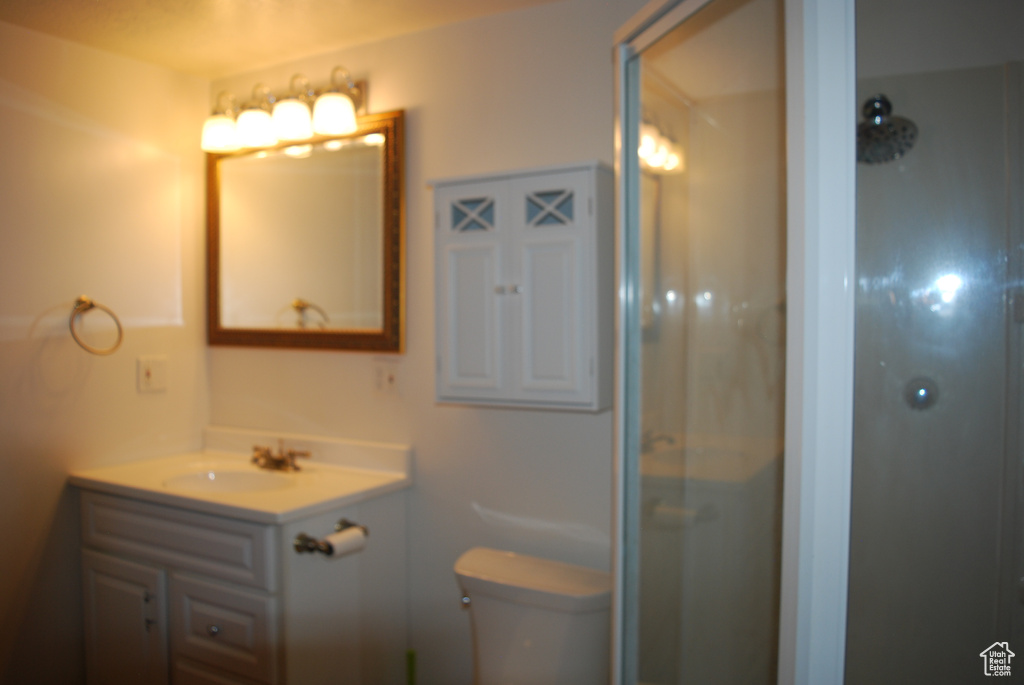 Full bathroom with vanity and a shower with shower door