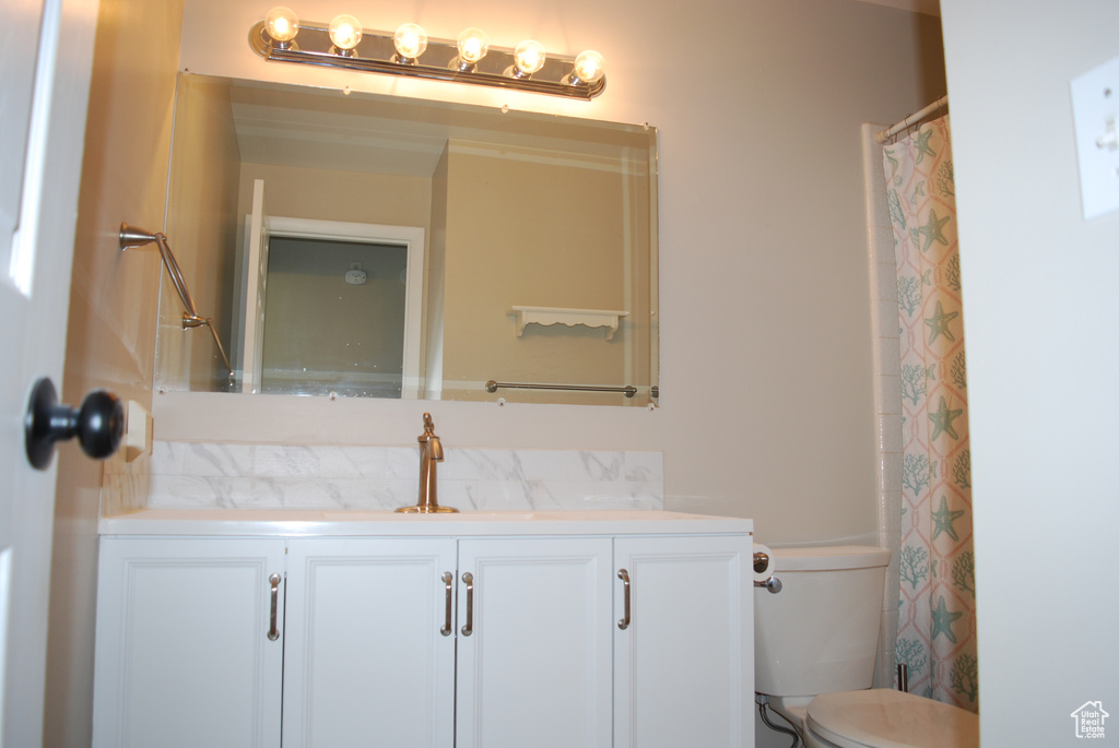 Bathroom with vanity and toilet