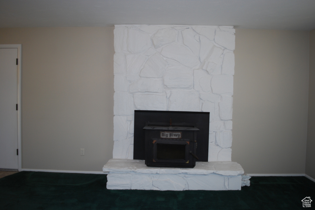 Detailed view of baseboards and a wood stove