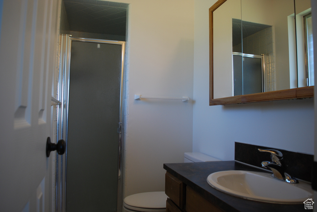 Full bathroom with a stall shower and vanity