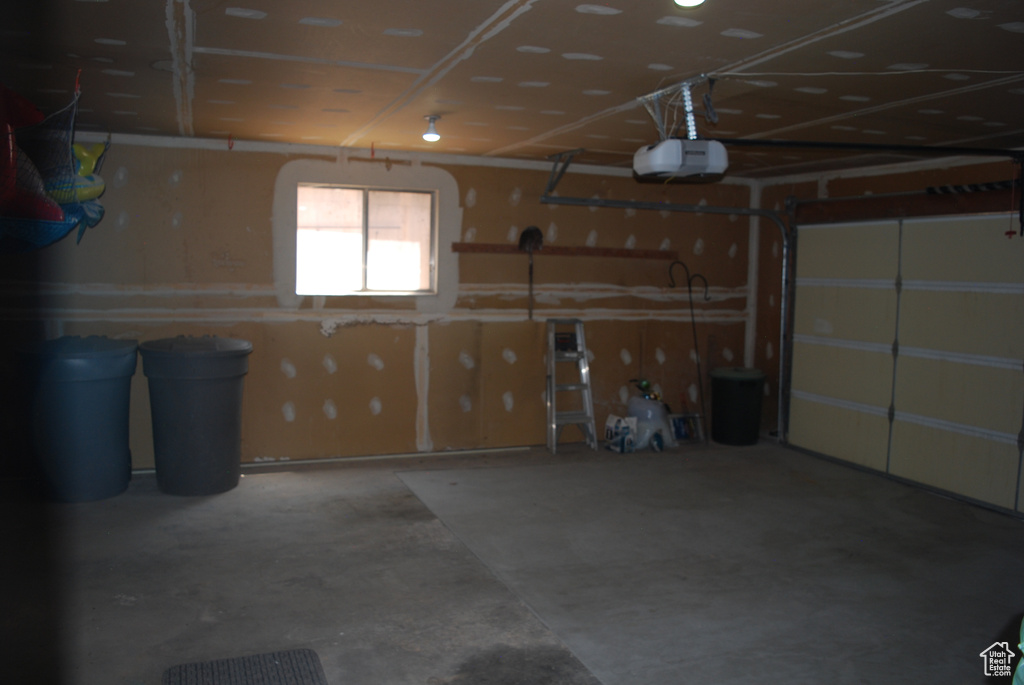 Garage featuring a garage door opener