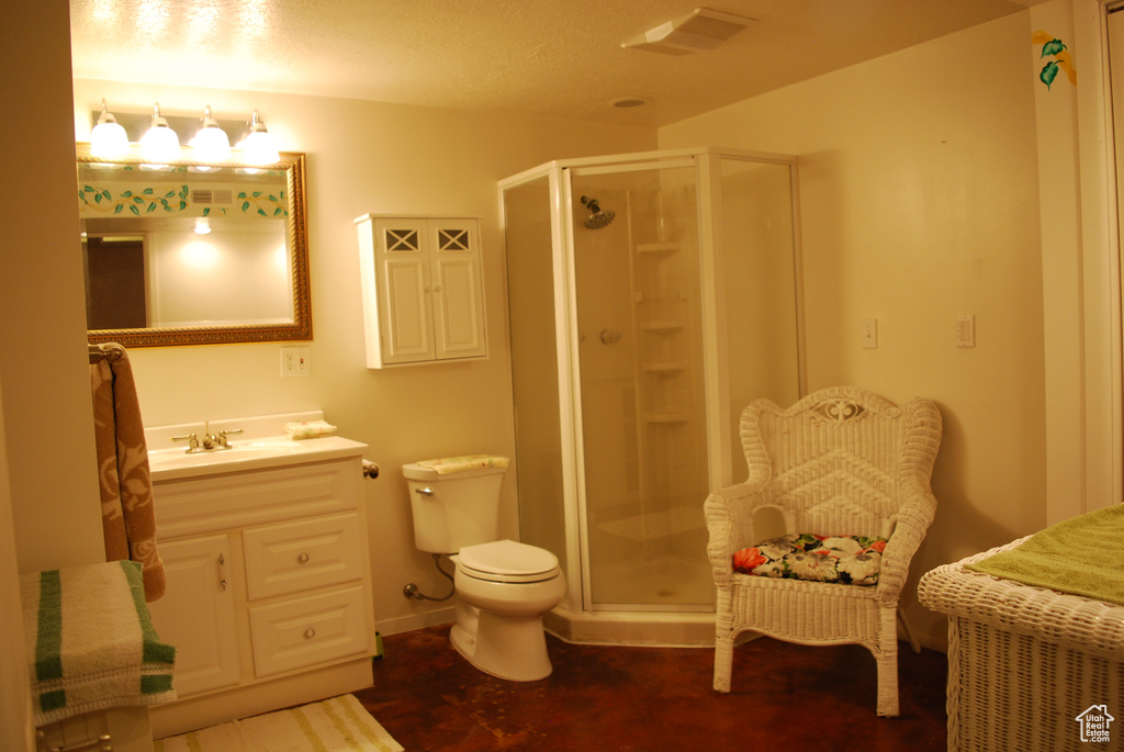 Full bath featuring visible vents, a shower stall, toilet, and vanity