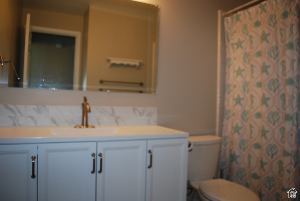Bathroom featuring vanity and a shower with shower curtain