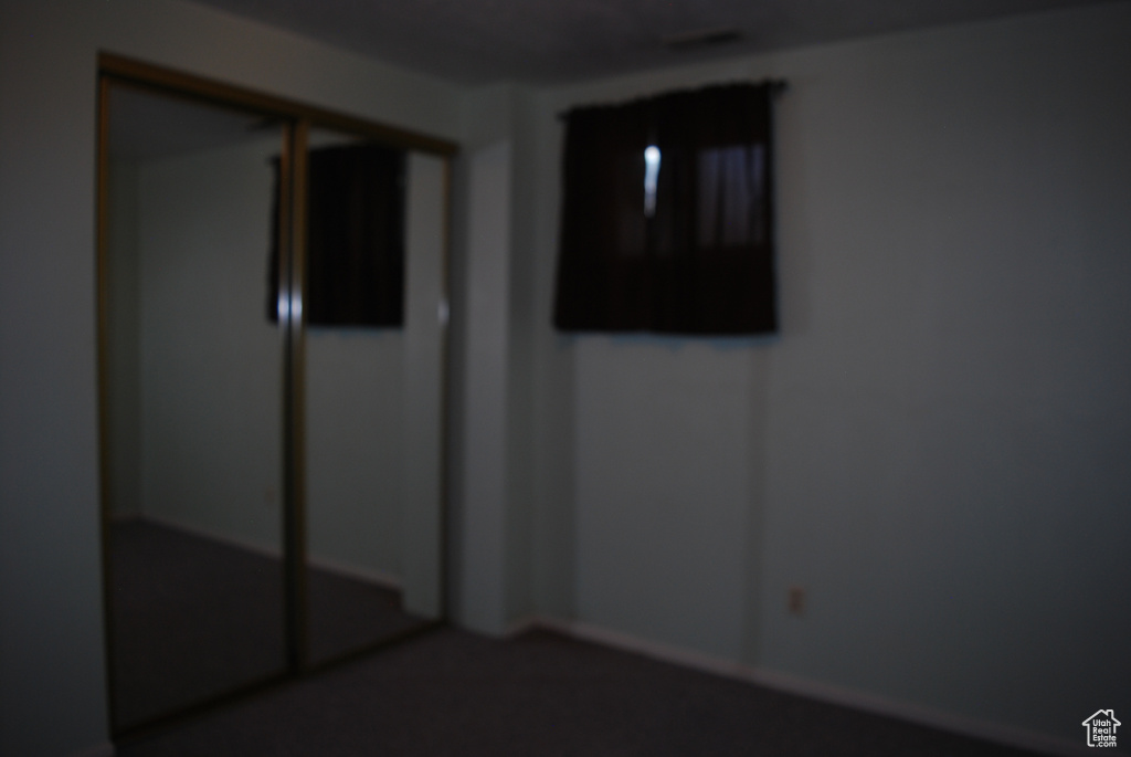 Below grade area featuring carpet flooring