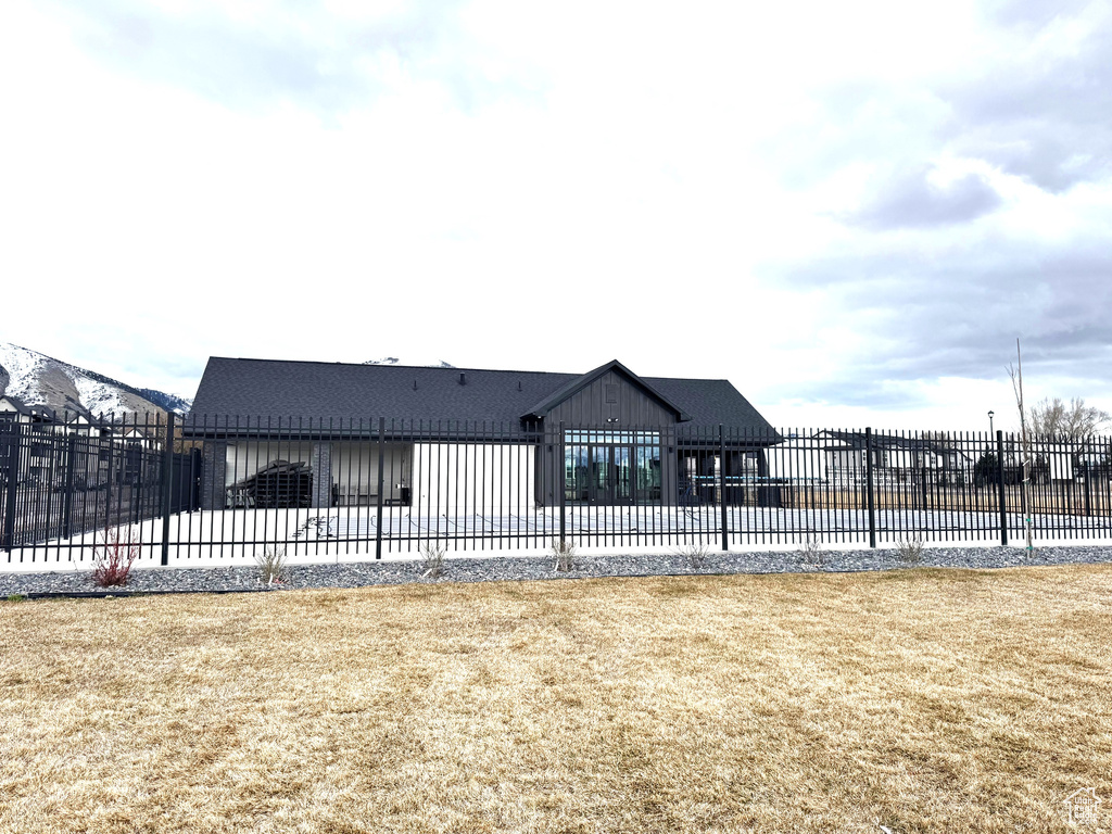Exterior space with a yard and fence