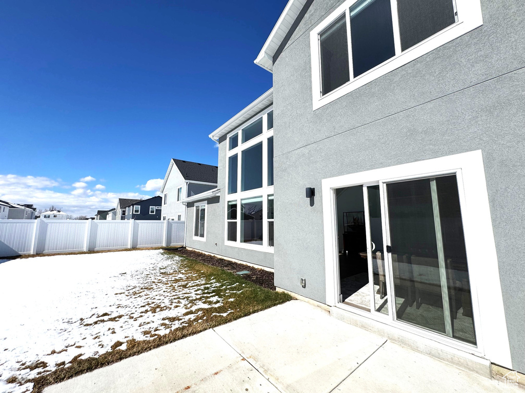 Exterior space with a patio and fence